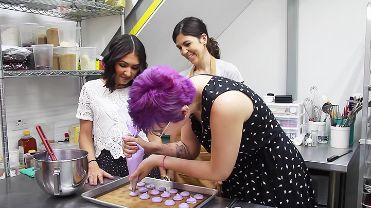 The colorful girls try for a day french macarons